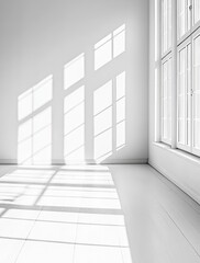 Obraz premium Light Streaming Through Large Windows Illuminates a Minimalist Room With Elegant Moldings in Soft Monochrome Tones