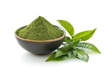 Green tea powder in a bowl with fresh tea leaves, isolated on a white background, showcasing its natural green hue.