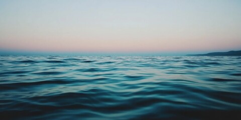 Obraz premium Tranquil Waves at Dusk over the Beautiful and Serene Ocean, capturing natures calmness