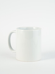Two-tone 11oz mug on isolated background. Mug with black handle and inner part.
