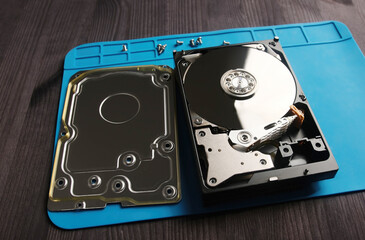 open hard data disk drive on a servicema's table