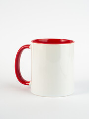 Two-tone 11oz mug on isolated background. Mug with red handle and inner part.