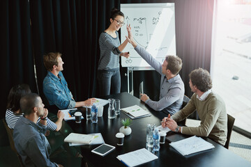 Team, presentation and high five in boardroom for meeting, business planning and white board...