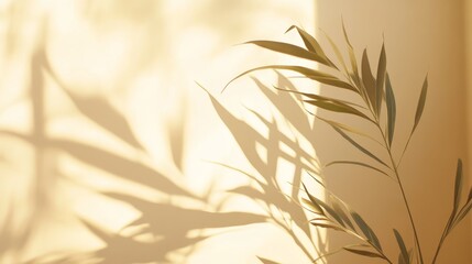 Obraz premium Delicate Shadows of Olive Leaves Cast on a Warm Beige Wall Create a Serene and Tranquil Atmosphere in Natural Light