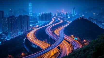 A sprawling highway system winds through a vibrant nighttime cityscape.