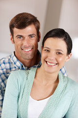 Obraz premium Couple, smile and portrait for dating, partnership and relationship for happy, love and relax in home. Boyfriend, girlfriend and young people in house for support, care and bonding together for break
