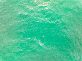 Naklejka premium Sea surface aerial view,Bird eye view photo of waves water surface texture,Summer sea background,Beautiful nature Amazing view sea background
