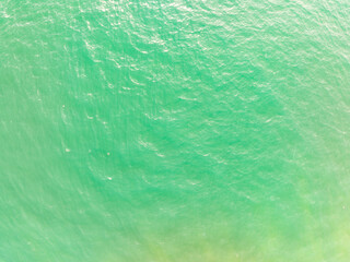 Obraz premium Sea surface aerial view,Bird eye view photo of waves water surface texture,Summer sea background,Beautiful nature Amazing view sea background