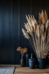 This stylish interior design showcases a harmonious blend of dried plants and a textured black wall, creating a chic and contemporary ambiance in the living space