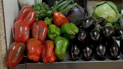 Colorful mix of fresh vegetables laying on a market stall, ready to be sold