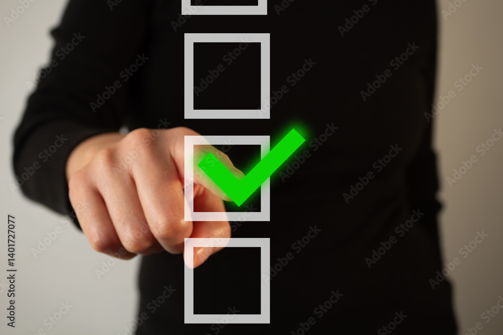 Poster a woman is pointing at a green check mark on a black background. the check mark is in the middle of 
