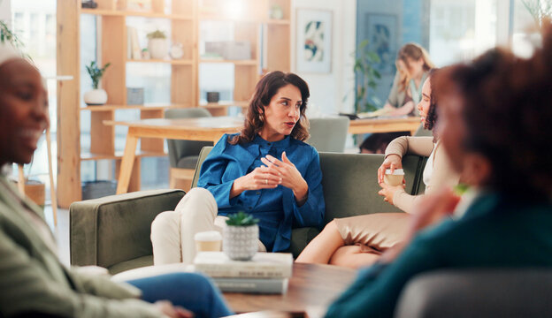 Office, business women and discussion on coffee break for planning project and meeting on sofa. Team, conversation and workers in company lounge for relax, brainstorming ideas and listening to story - Powered by Adobe