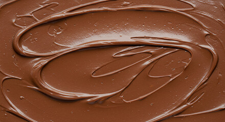 A top view shot of luscious chocolate cream elegantly spread on a clean white surface emphasizing its velvety texture and deep rich brown color
