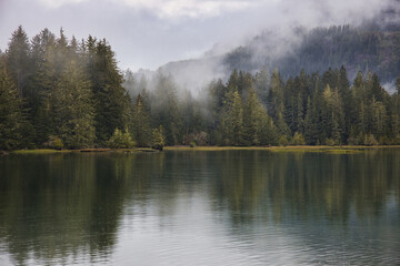 Pacheedaht mountain - fog and trees - located in Port Renfrew is a popular west coast Vancouver Island travel destination.