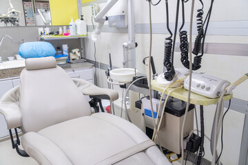 Dental laboratory workbench equipped with furnace, tools, and materials for manufacturing crowns, bridges, and other dental prosthetics. Dental technology workspace.