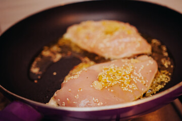 Marinated chicken breast frying with Asian spices – bold flavors meet health concerns over frying in modern cooking