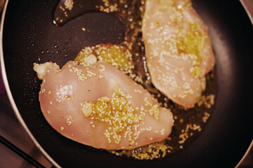 Marinated chicken breast frying with Asian spices – bold flavors meet health concerns over frying...