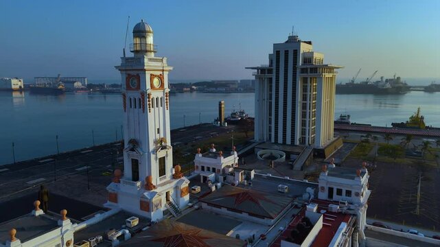 Veracruz, Mexico. February 24, 2025: View of the Venustiano Carranza Lighthouse at sunrise, historic 1902 neoclassical building on the Gran Plaza del Malecon.