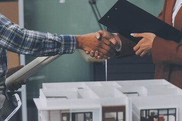 Construction, planning and architects meeting about design of building, strategy and working in industrial collaboration. Architecture workers talking about maintenance project with paper and a model