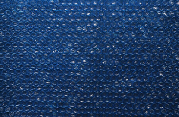 Obraz premium bubble wrap, close-up photo with selective focus. It is a pliable transparent plastic material with bubbles of air used for packing fragile items