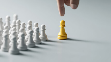A hand reaches for a yellow chess pawn surrounded by white pawns, symbolizing strategy and decision-making in a game of chess.