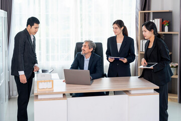 cheerful senior boss during business meeting,employees having conference in boardroom,conversation,consulting,discussing
