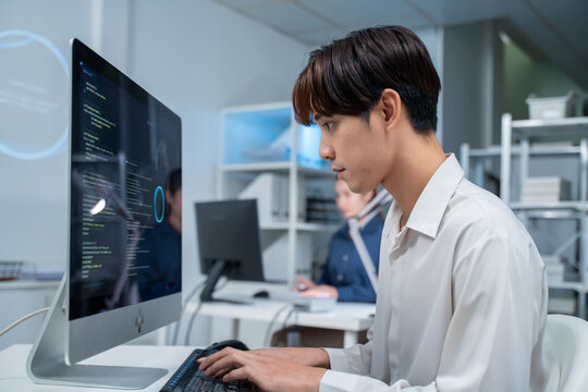 software developer talk strategy plan to executive write prompt AI bot IT app program data analytics in tech startup office.Projected visuals and glowing code on screen.AI chatbot technology concept
