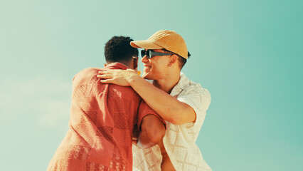 Smile, men and friends for hug outdoor for greeting, meeting and success of getaway vacation. Below, people and blue sky with embrace of reunion agreement, introductions and thank you of holiday trip