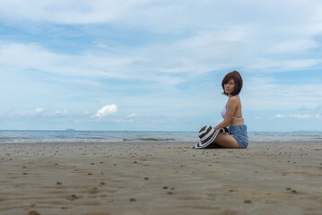 Asia happy Summer vacations Lifestyle woman relax and chill on beach background and Lifestyle and Travel Concept.