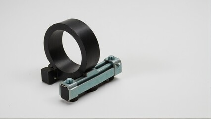 Obraz premium A Study of Mechanics: Exploring Interconnected Components Through Contrasting Materials and a Plain White Backdrop Showcasing the Beauty of Simplicity