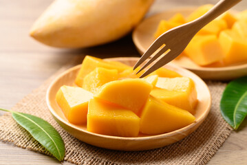 Cube mango on wooden plate ready to eating, Tropical fruit in summer season