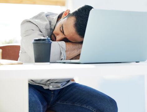 Laptop, coffee and sleep for man at desk, office or exhausted for work deadline. Burnout, rest or computer for tired web design, creative block or email for fatigue employee with overload pressure