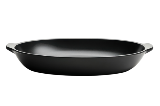 Elegant black oval baking dish with sleek handles perfect for culinary creations against a stark black backdrop