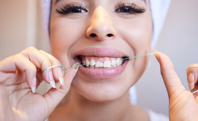 Dental, portrait and woman flossing teeth for cleaning, health or oral hygiene in home bathroom....