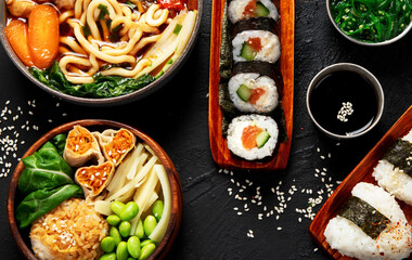 Traditional Japanese food dishes served on the table.