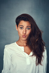 Pout and comedy in portrait, woman and confident by backdrop, hair and face for casual fashion....
