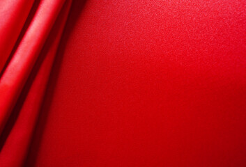 abstract background red silk or satin velvet. Luxurious, elegant. Curtains, curtains, flowing waves...