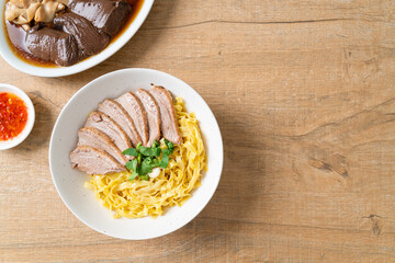 dried duck noodles in white bowl