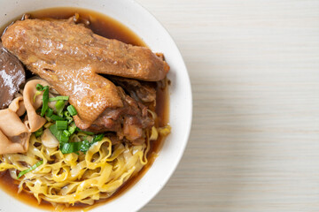 egg noodles with stewed and braised duck in brown soup
