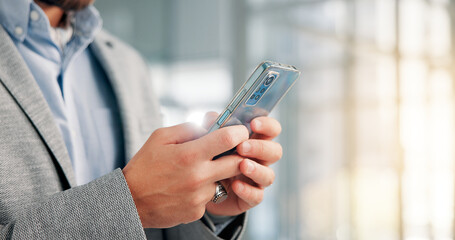 Hands, business and man in office, cellphone and digital app for email, connection and social media. Closeup, person and employee in workplace, smartphone or economy analyst with website info or text