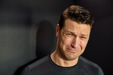 Portrait of sad man crying.