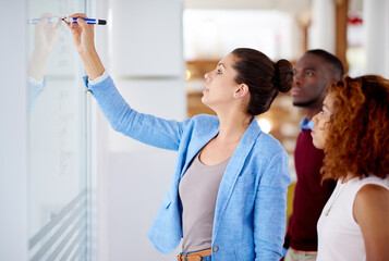 Problem solving, business people and writing on glass board in meeting for brainstorming, ideas or...