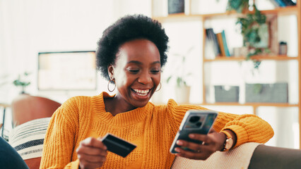 Home, credit card and black woman on sofa, smartphone and online payment with smile. Apartment,...
