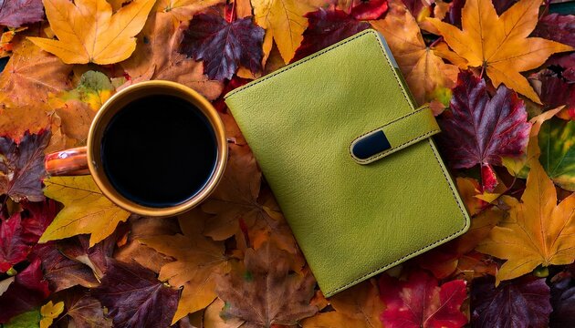 notebook and autumn leaves