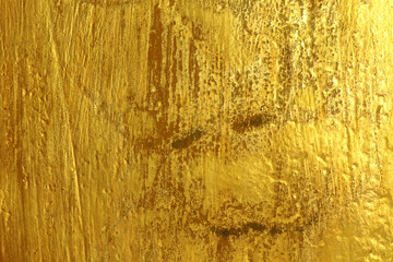 Scratched and damaged old gold background