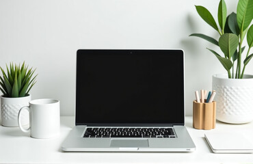 Fototapeta premium A Minimalist Office Setup Includes A Laptop, A Simple White Coffee Mug, And Functional Desk Decorations.