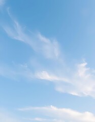 Soft pastel blue sky, wispy white clouds drift gently, sky, blue, ethereal