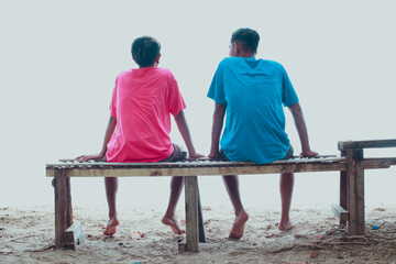 Fototapeta premium Two Friends Relaxing by the Sea