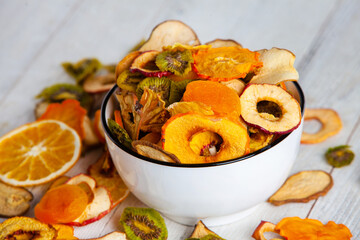 Organic Healthy Assorted Dried Fruit Mix close up. Dried fruit snacks. dried apples, mango, feijoa,...