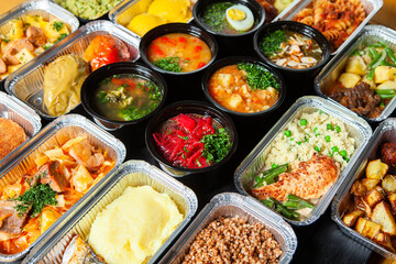 Business lunch in eco plastic container ready for delivery.Top view. Office Lunch boxes with food ready to go. Food takes away. Catering, brakfast.